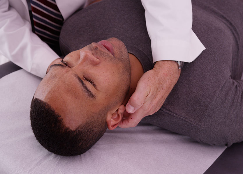 Image of a man getting an adjustment